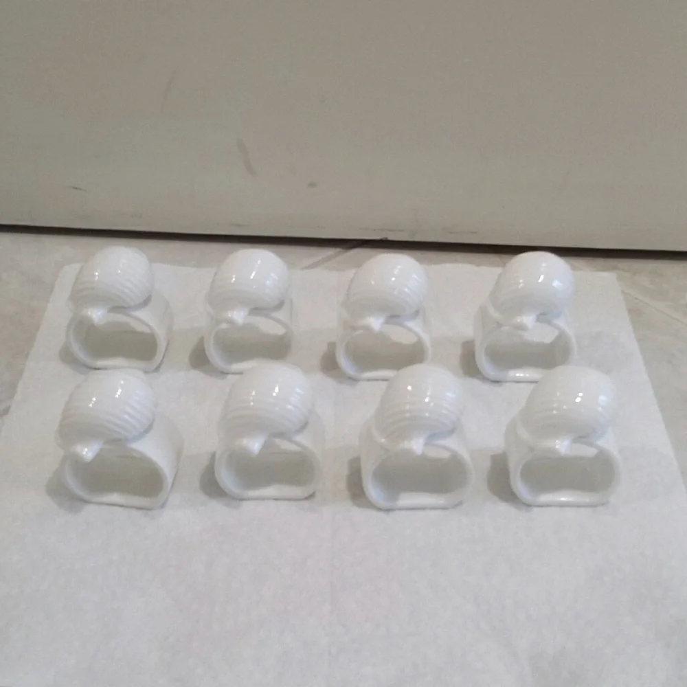 Set of 8 ceramic shell napkin ring holders